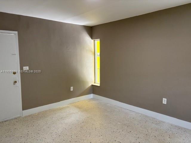 828 Southwest 20th Avenue, Unit 7 Miami, FL 33135 - Photo 6 of 13 an empty room with windows