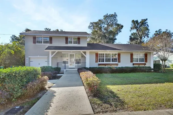 a front view of a house with garden