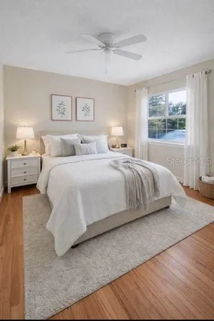 a bedroom with a bed and window