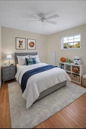 a bedroom with a bed and window