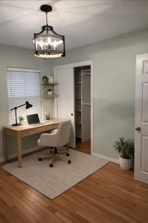 a workspace with furniture and wooden floor