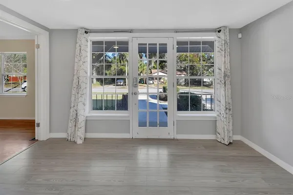 a view of an empty room with a window