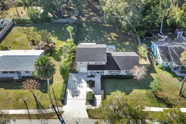 an aerial view of residential houses with outdoor space
