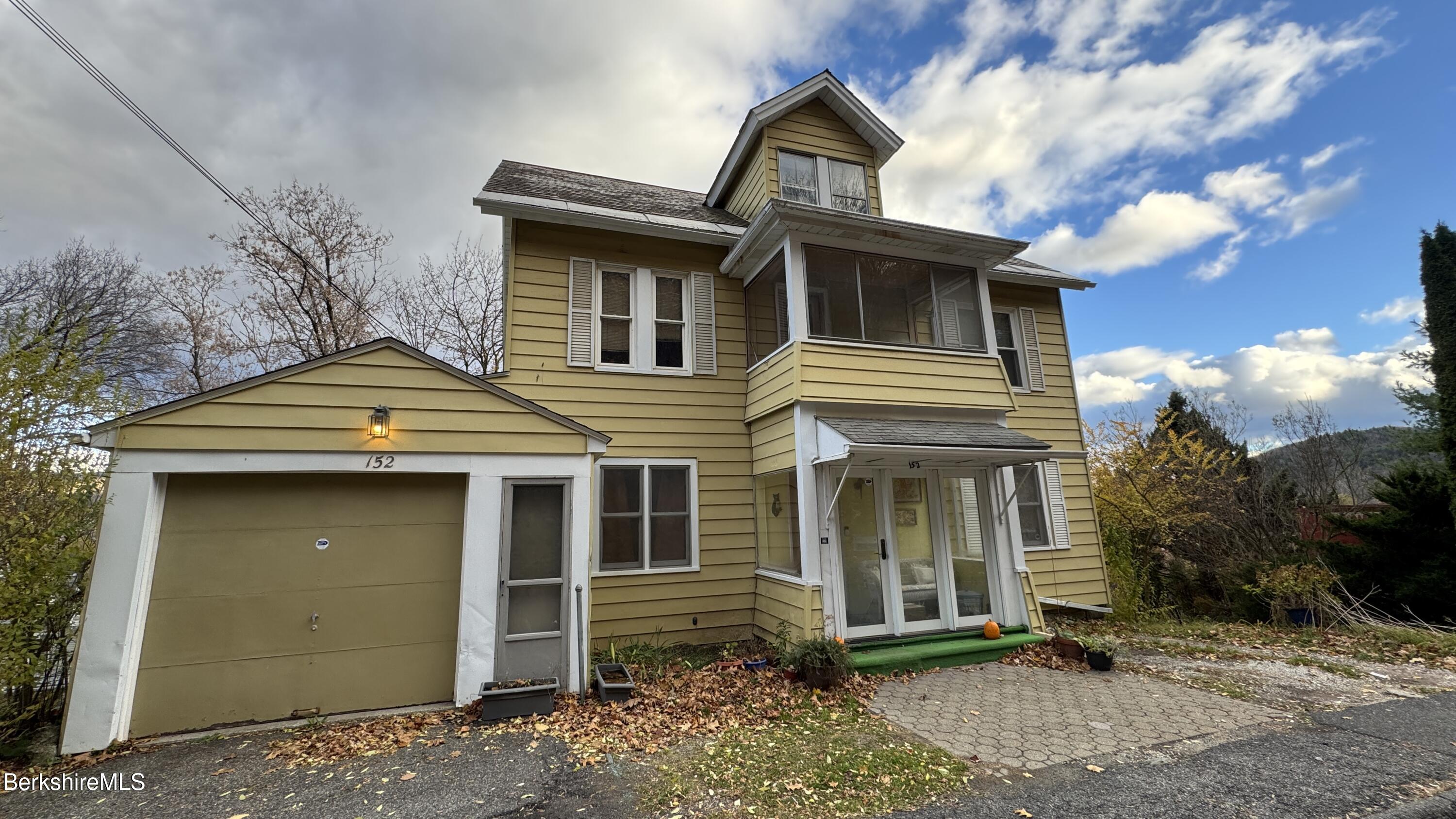 front view of a house with a yard