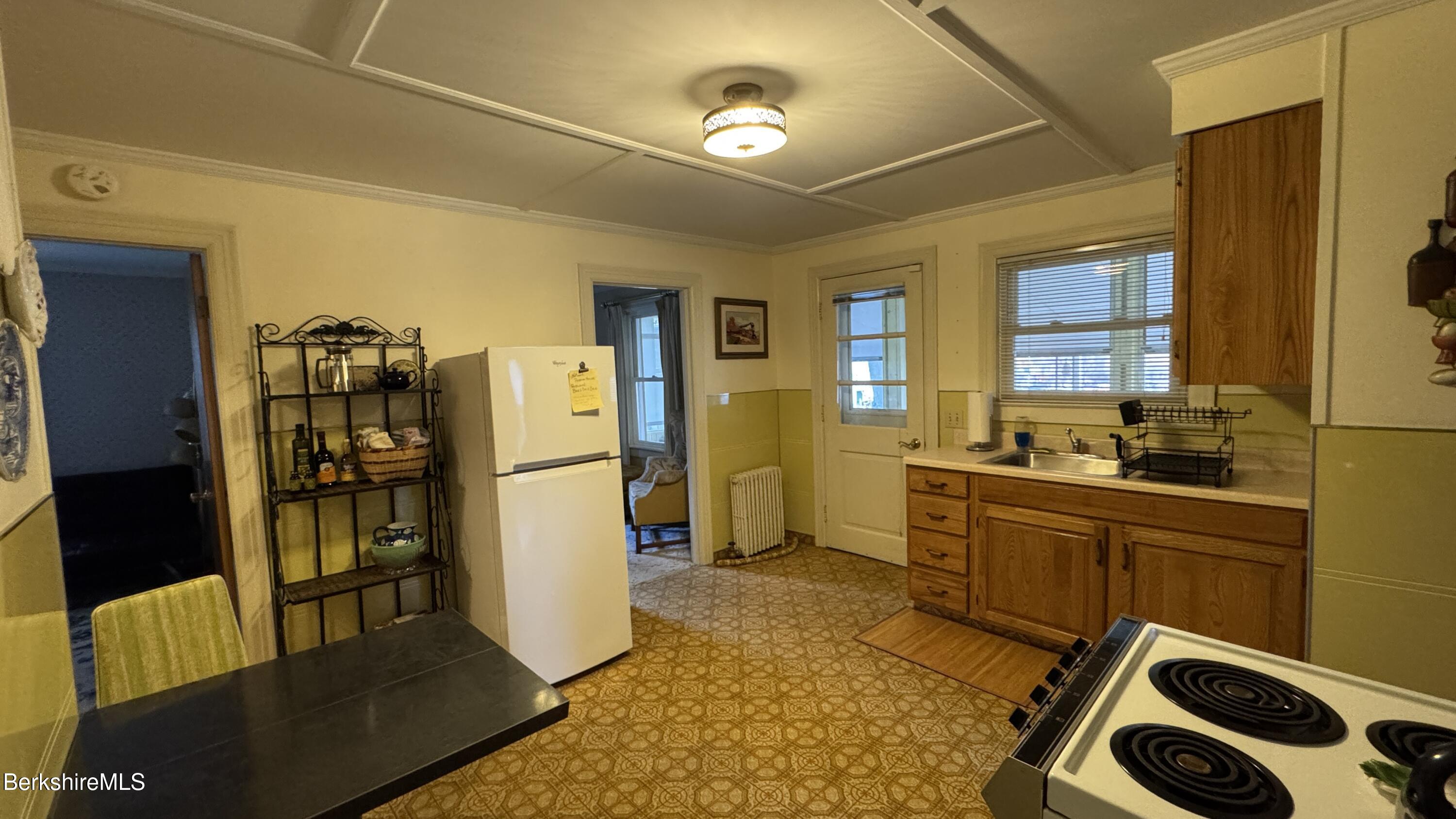 152 Furnace Street North Adams, MA 01247 - Photo 22 of 30 a kitchen with a refrigerator and a sink