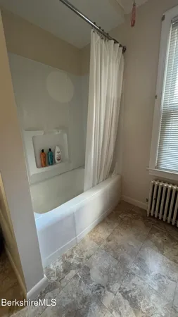 a view of walk in closet with window