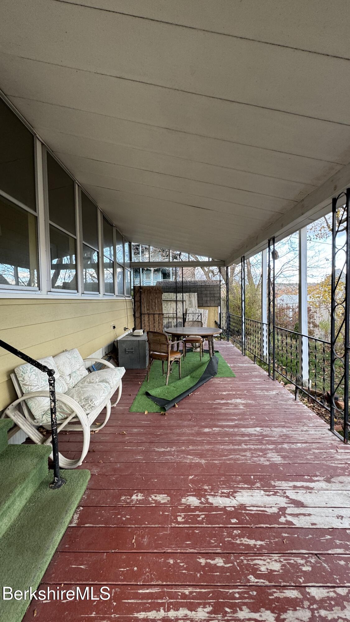 152 Furnace Street North Adams, MA 01247 - Photo 4 of 30 a view of a patio with a table and chairs under an umbrella