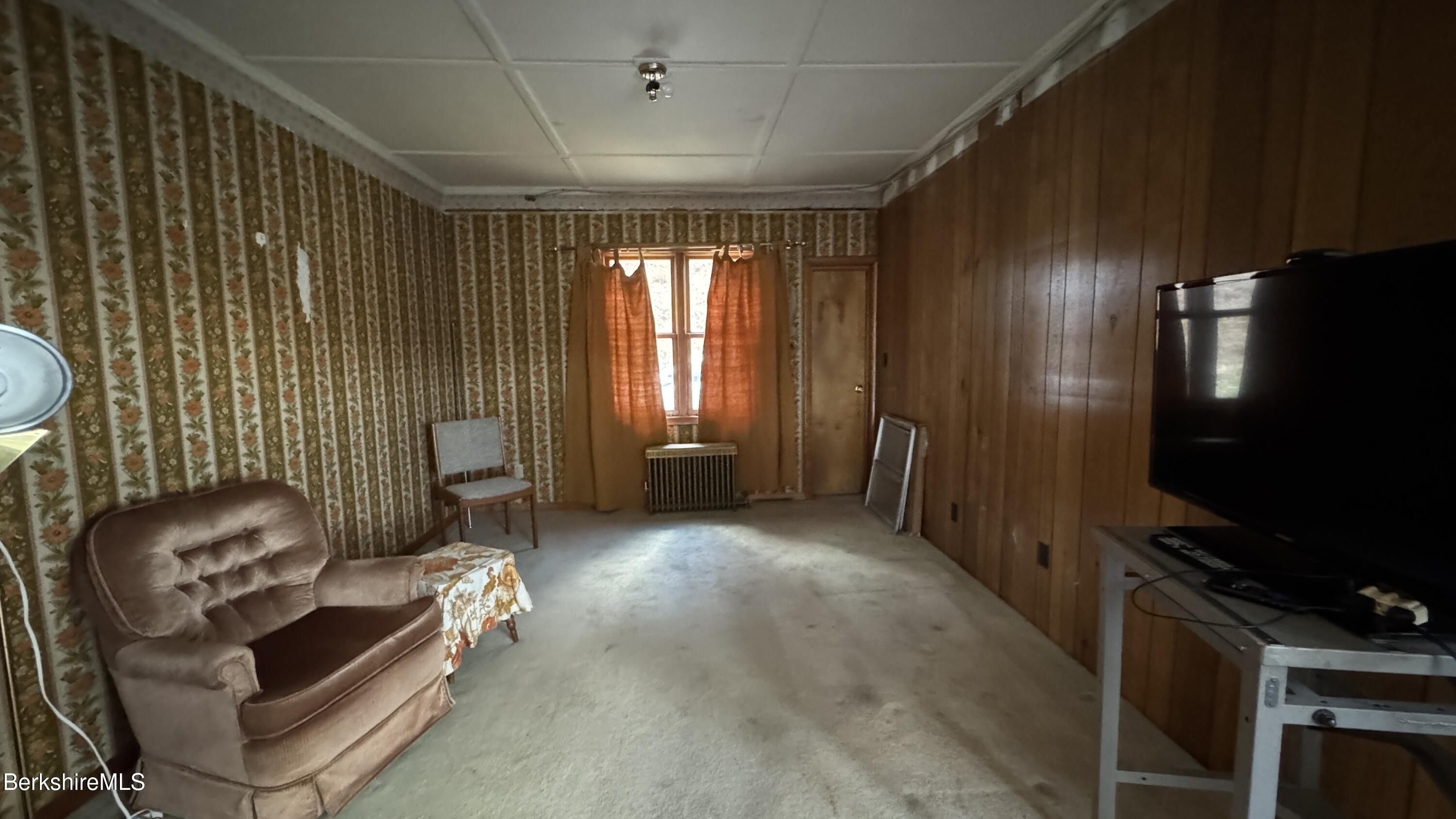 152 Furnace Street North Adams, MA 01247 - Photo 8 of 30 a living room with furniture and a flat screen tv