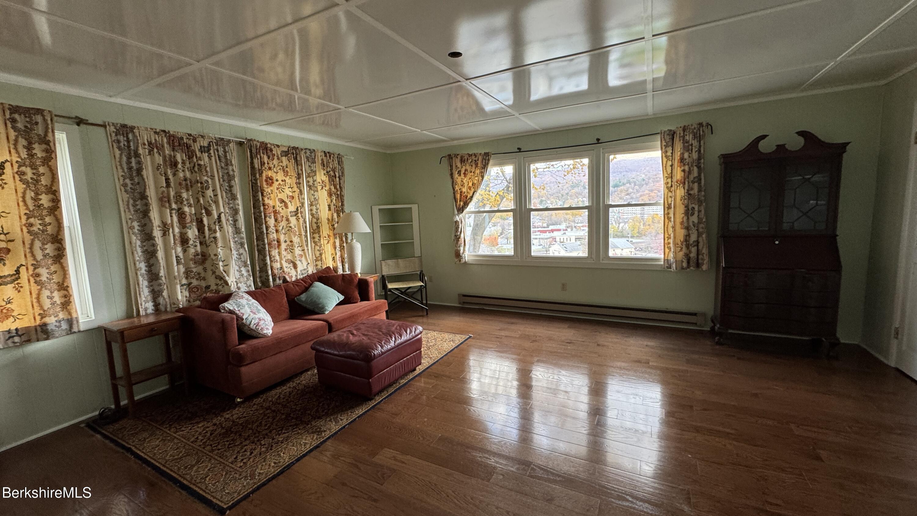 152 Furnace Street North Adams, MA 01247 - Photo 10 of 30 a living room with furniture and large windows