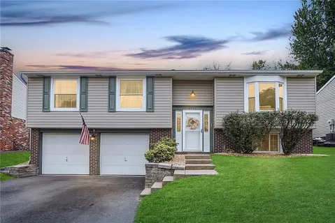 front view of a house with a yard