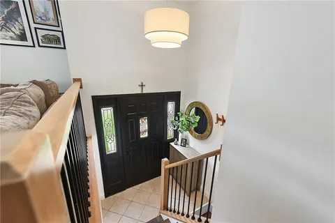 a view of entryway with wooden floor