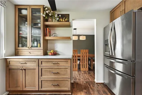 a kitchen with appliances and cabinets