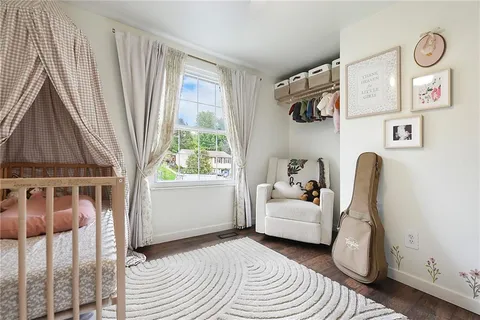 a bedroom with furniture and a window