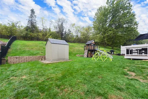 a view of a park with large trees