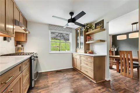 a kitchen with stainless steel appliances granite countertop a stove and a sink