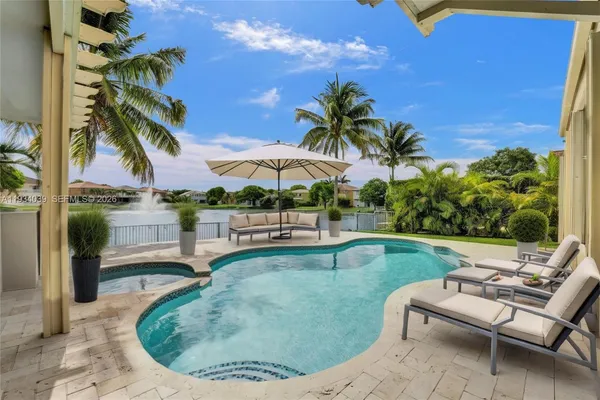 a view of a swimming pool and lounge chair