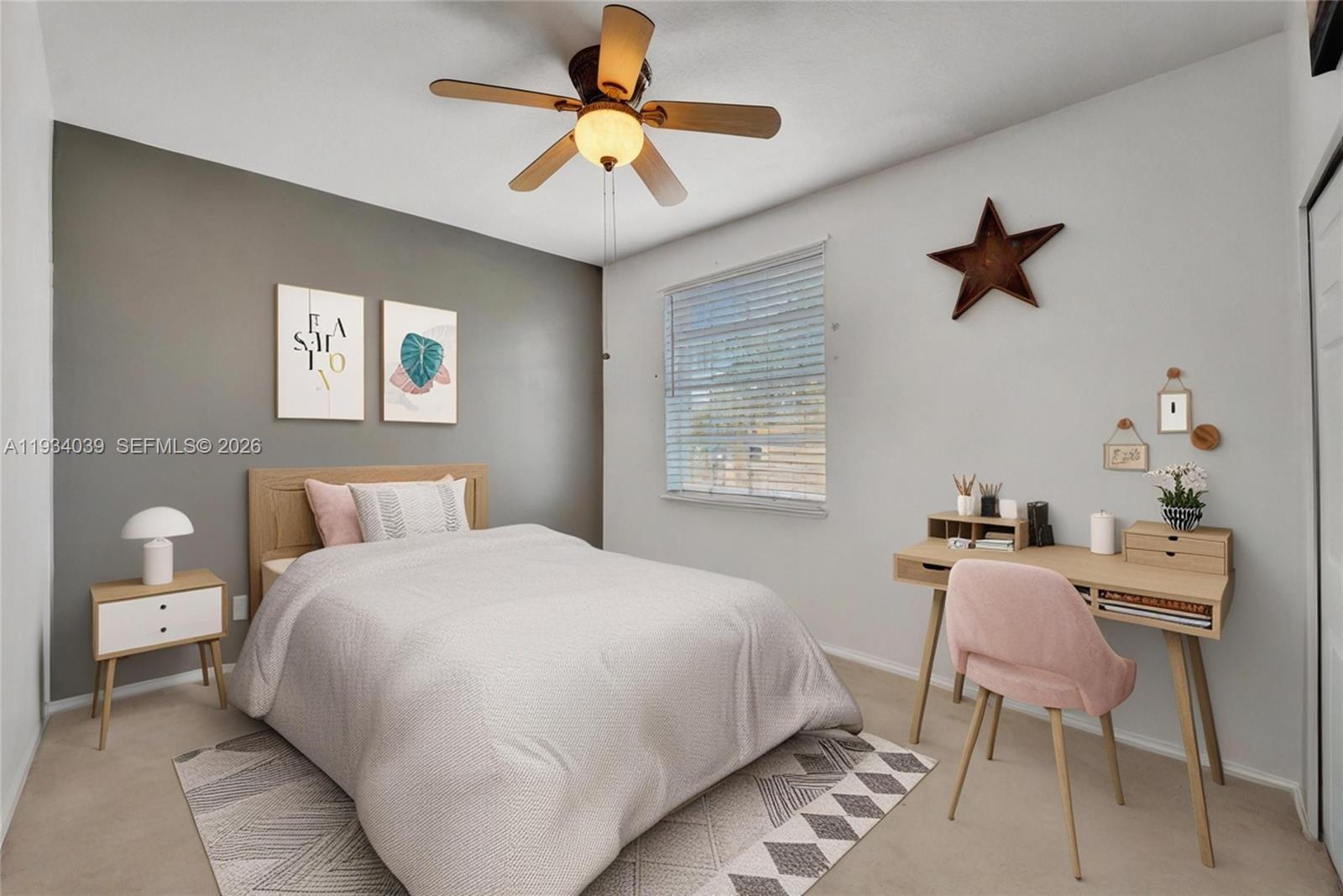5337 Southwest 131st Terrace Miramar, FL 33027 - Photo 23 of 46 a bedroom with a bed and a chandelier