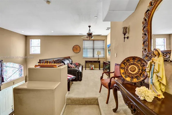 a living room with furniture and a window
