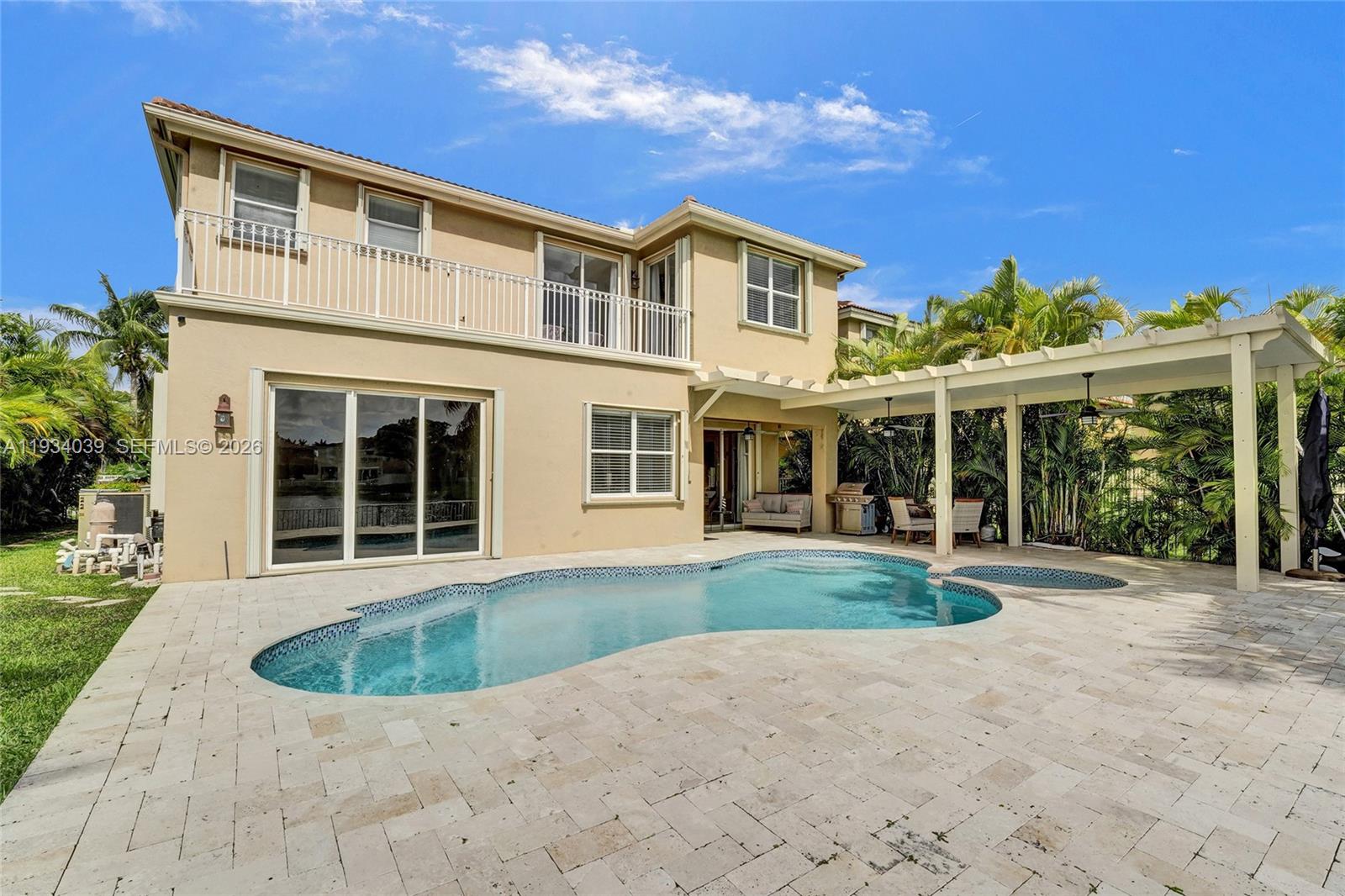 5337 Southwest 131st Terrace Miramar, FL 33027 - Photo 31 of 46 a front view of a house with a yard and potted plants
