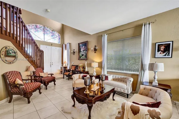a living room with furniture and a large window