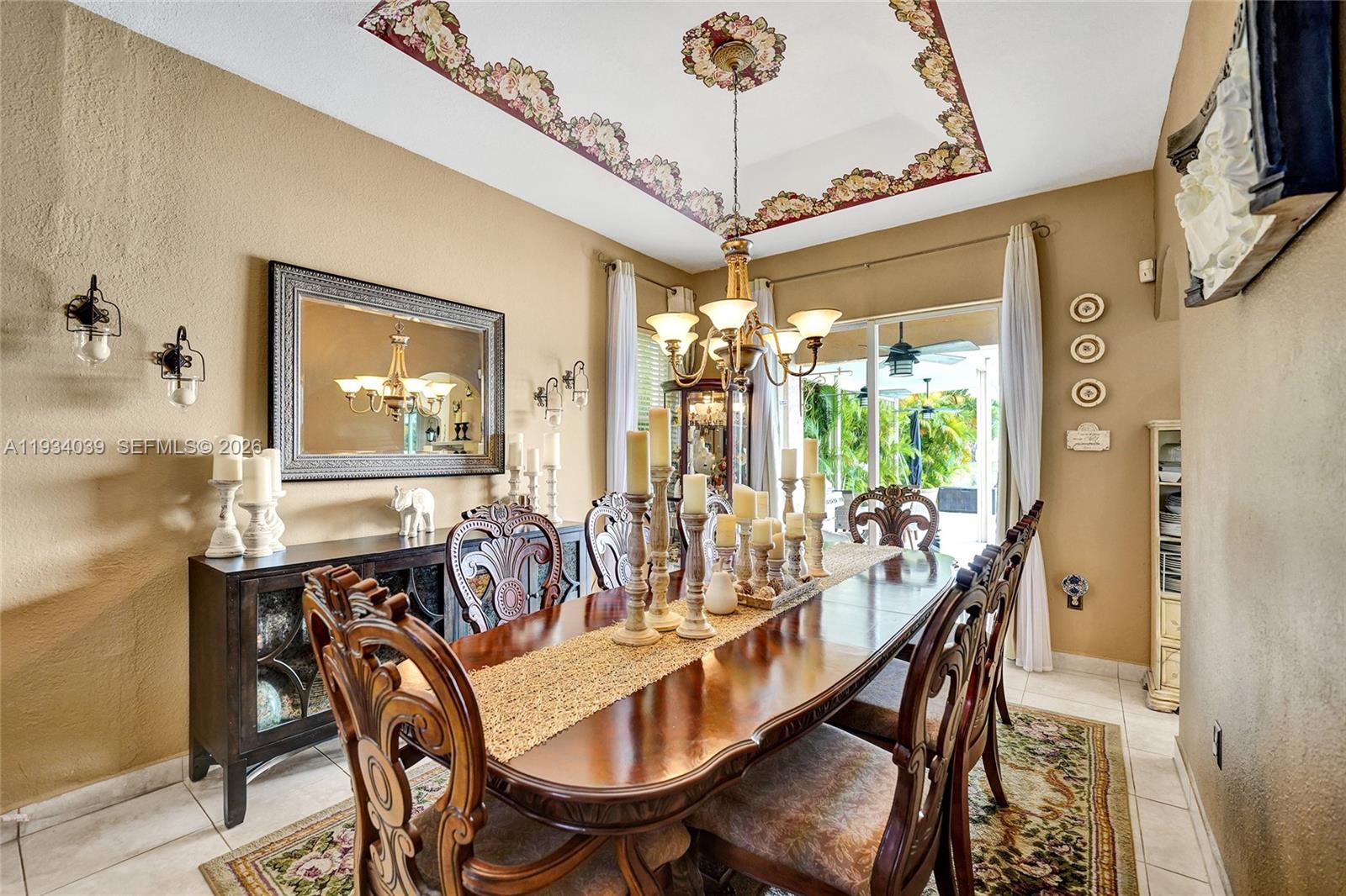 5337 Southwest 131st Terrace Miramar, FL 33027 - Photo 5 of 46 a dining room with furniture a chandelier and wooden floor