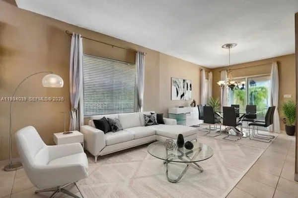 a living room with furniture and a large window