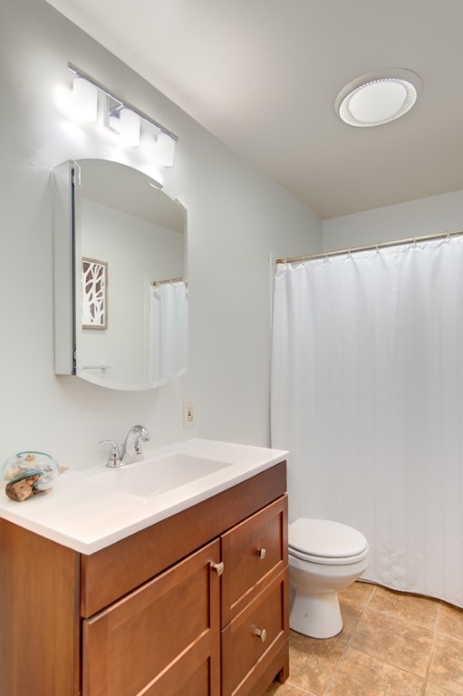 259 Malboeuf Road Ware, MA 01082 - Photo 13 of 20 a bathroom with a sink mirror vanity and toilet