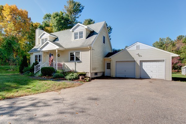 259 Malboeuf Road Ware, MA 01082 - Photo 18 of 20 a view of a house with a yard and potted plants