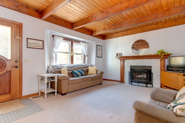 259 Malboeuf Road Ware, MA 01082 - Photo 5 of 20 a living room with furniture a fireplace and a window