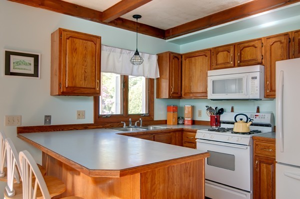 259 Malboeuf Road Ware, MA 01082 - Photo 8 of 20 a kitchen with stainless steel appliances granite countertop a sink a stove and a refrigerator