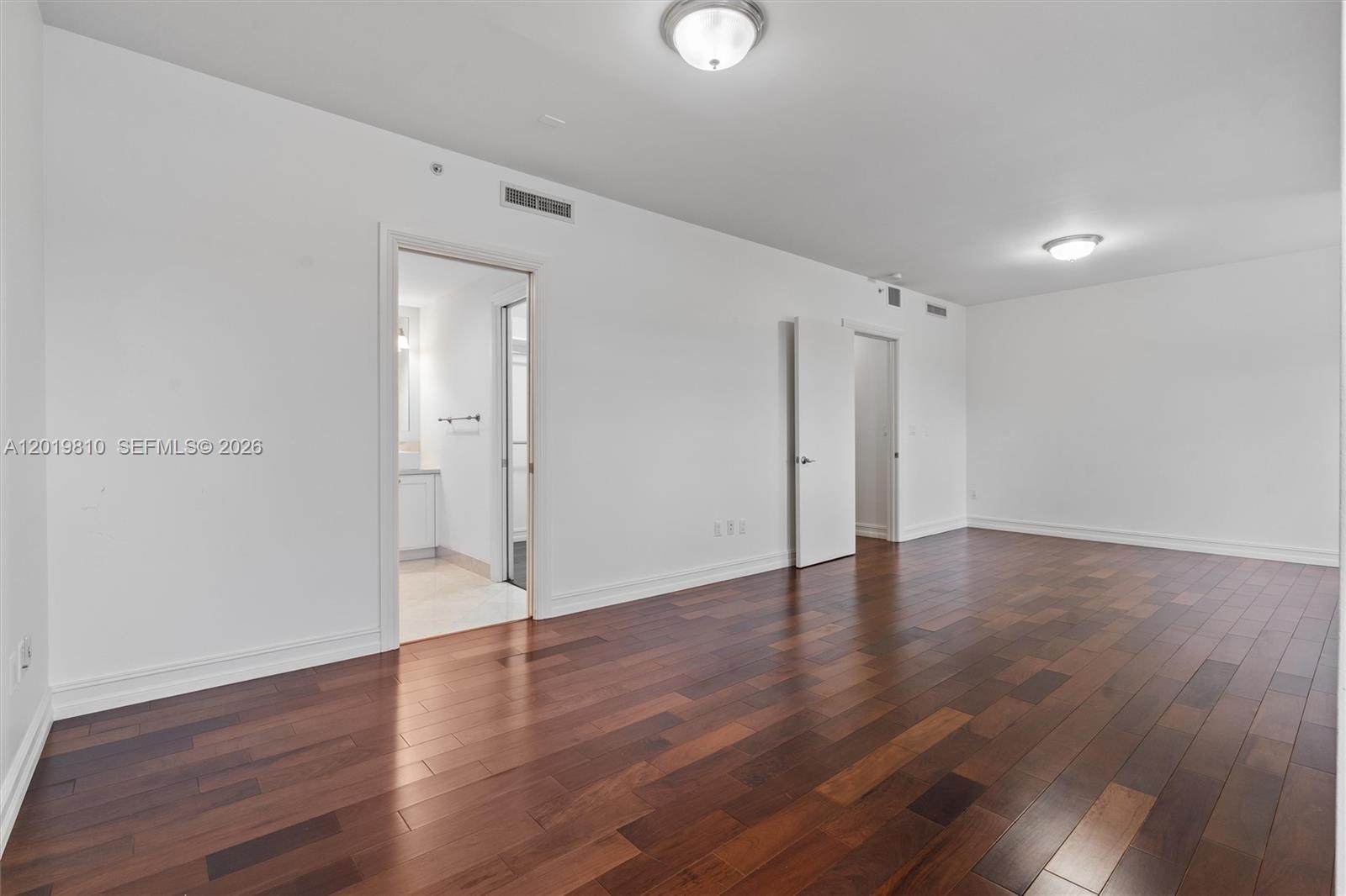 455 East Palmetto Park Road, Unit 4E Boca Raton, FL 33432 - Photo 23 of 30 a view of an empty room with wooden floor