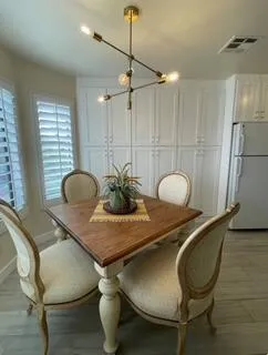 a dining room with furniture and window
