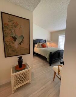40880 Whirling Wind Drive, Unit C Palm Desert, CA 92211 - Photo 13 of 15 a living room with furniture and a window