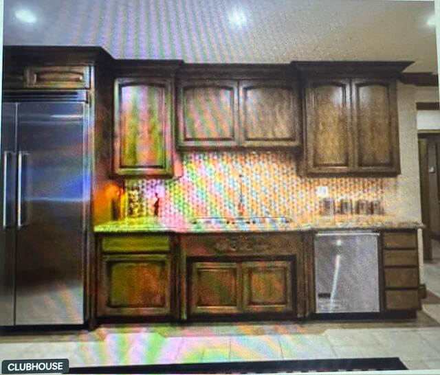 40880 Whirling Wind Drive, Unit C Palm Desert, CA 92211 - Photo 15 of 15 a kitchen with granite countertop a stove and cabinets