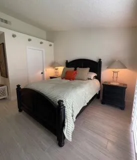 a bedroom with bed and a window