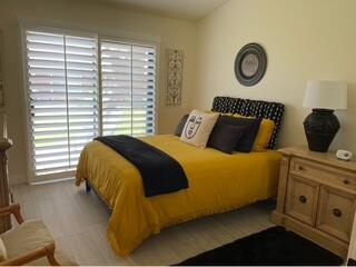 40880 Whirling Wind Drive, Unit C Palm Desert, CA 92211 - Photo 6 of 15 a bedroom with a bed and a window