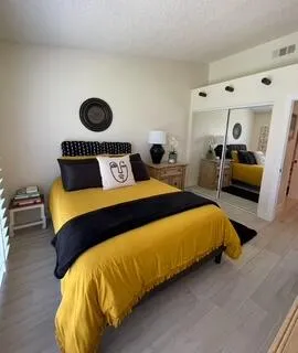 a bedroom with a bed and walk in closet
