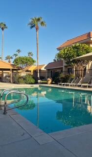 40880 Whirling Wind Drive, Unit C Palm Desert, CA 92211 - Photo 9 of 15 a view of a house with a yard
