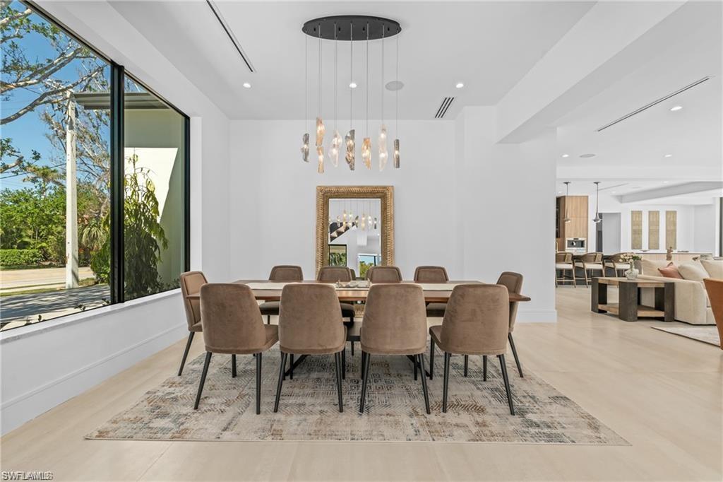 1800 Crayton Road Naples, FL 34102 - Photo 13 of 32 Formal Dining space with plenty of natural light, a chandelier, and recessed lighting