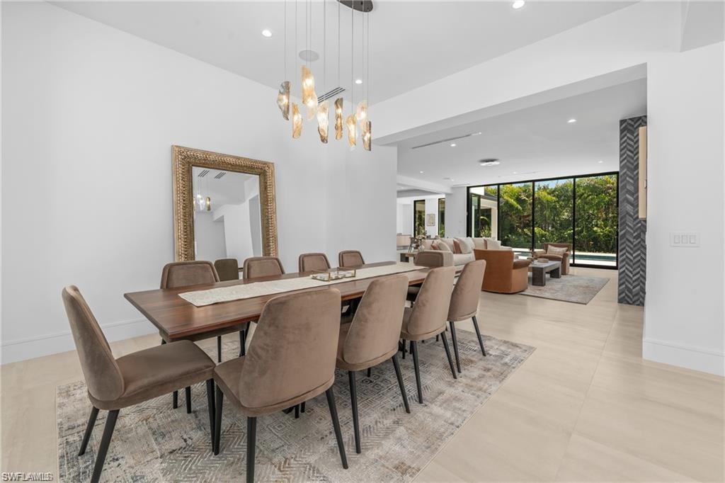 1800 Crayton Road Naples, FL 34102 - Photo 14 of 32 Formal Dining area with recessed lighting and floor to ceiling windows