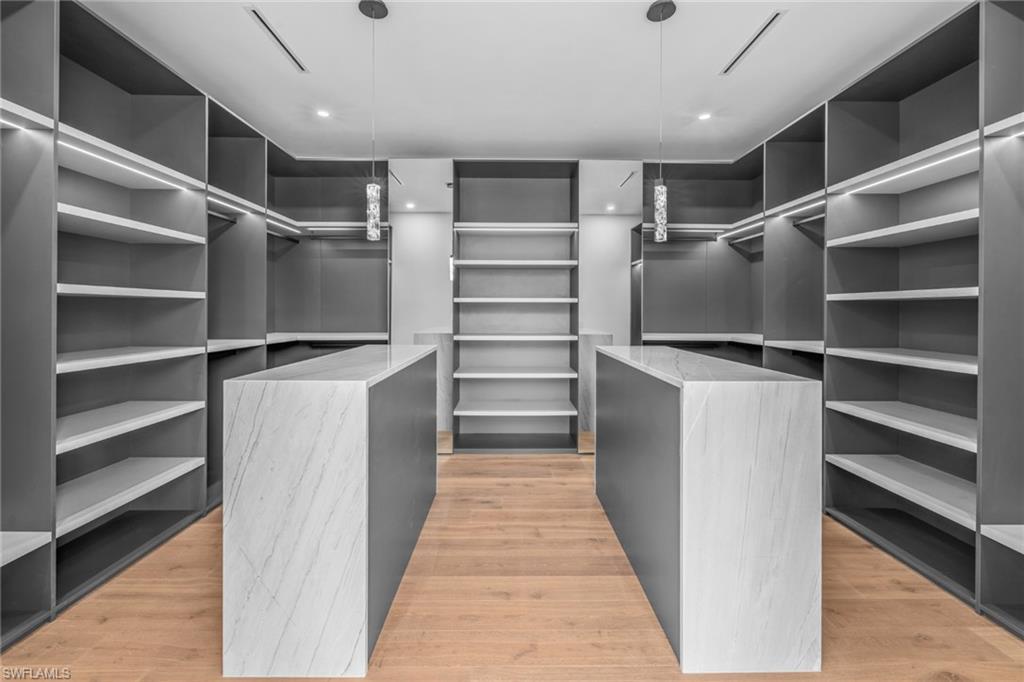 1800 Crayton Road Naples, FL 34102 - Photo 16 of 32 Spacious closet featuring light wood-style flooring