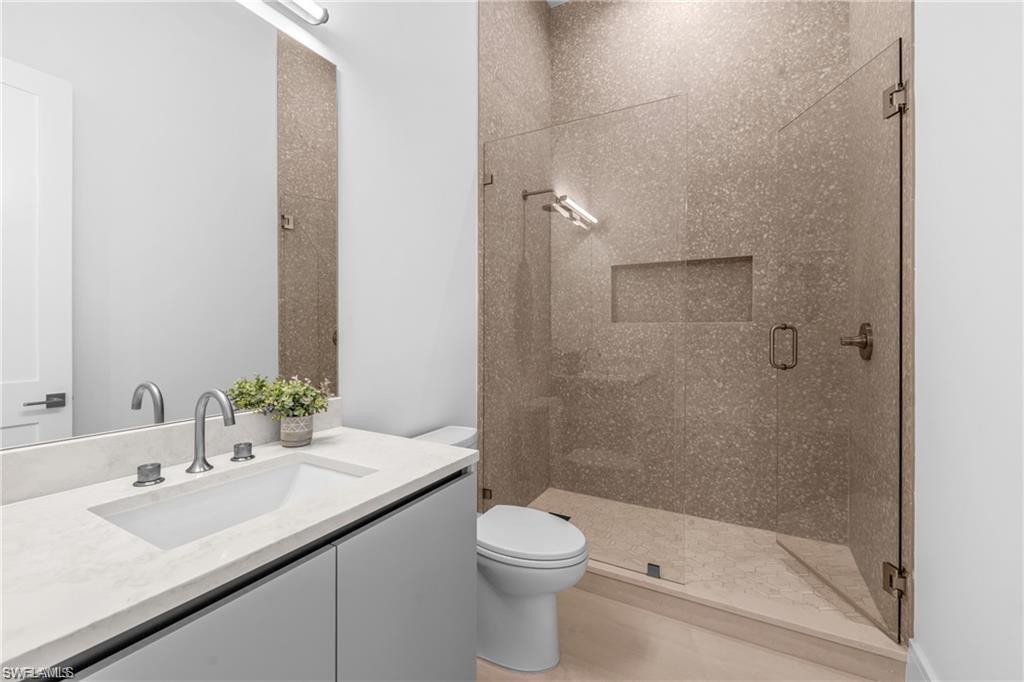 1800 Crayton Road Naples, FL 34102 - Photo 22 of 32 Full bath with a stall shower and vanity