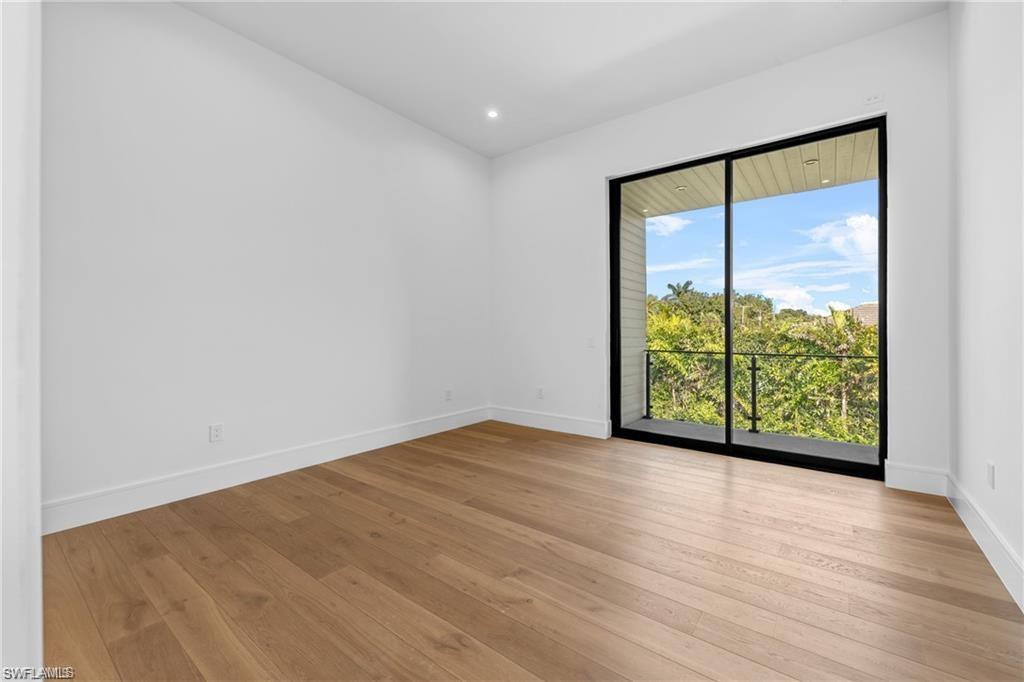1800 Crayton Road Naples, FL 34102 - Photo 23 of 32 Unfurnished room with light wood-type flooring and recessed lighting