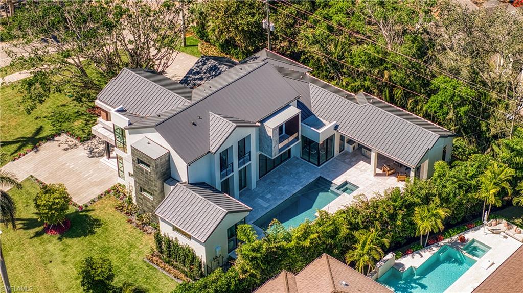 1800 Crayton Road Naples, FL 34102 - Photo 3 of 32 View from above of property featuring a pool area