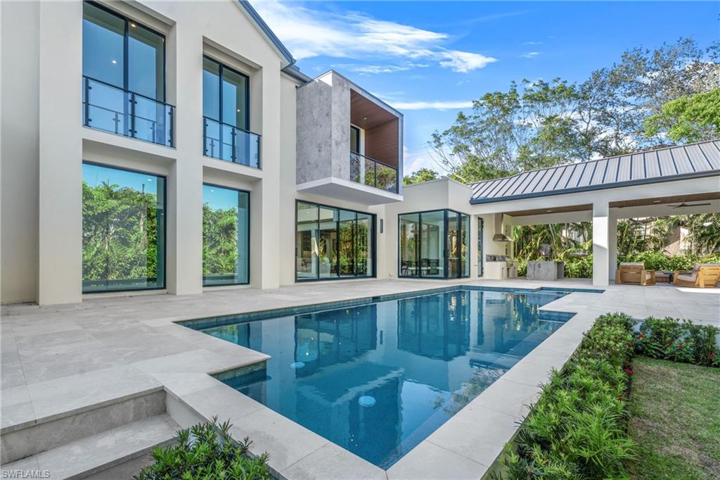 1800 Crayton Road Naples, FL 34102 - Photo 4 of 32 Swimming pool with a patio and a balcony