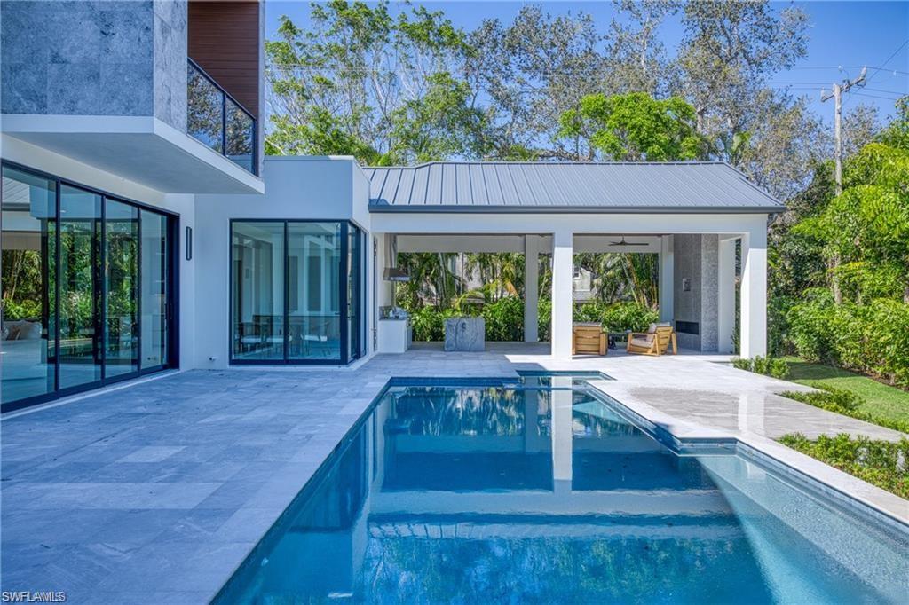 1800 Crayton Road Naples, FL 34102 - Photo 5 of 32 Outdoor pool with a patio area and a balcony