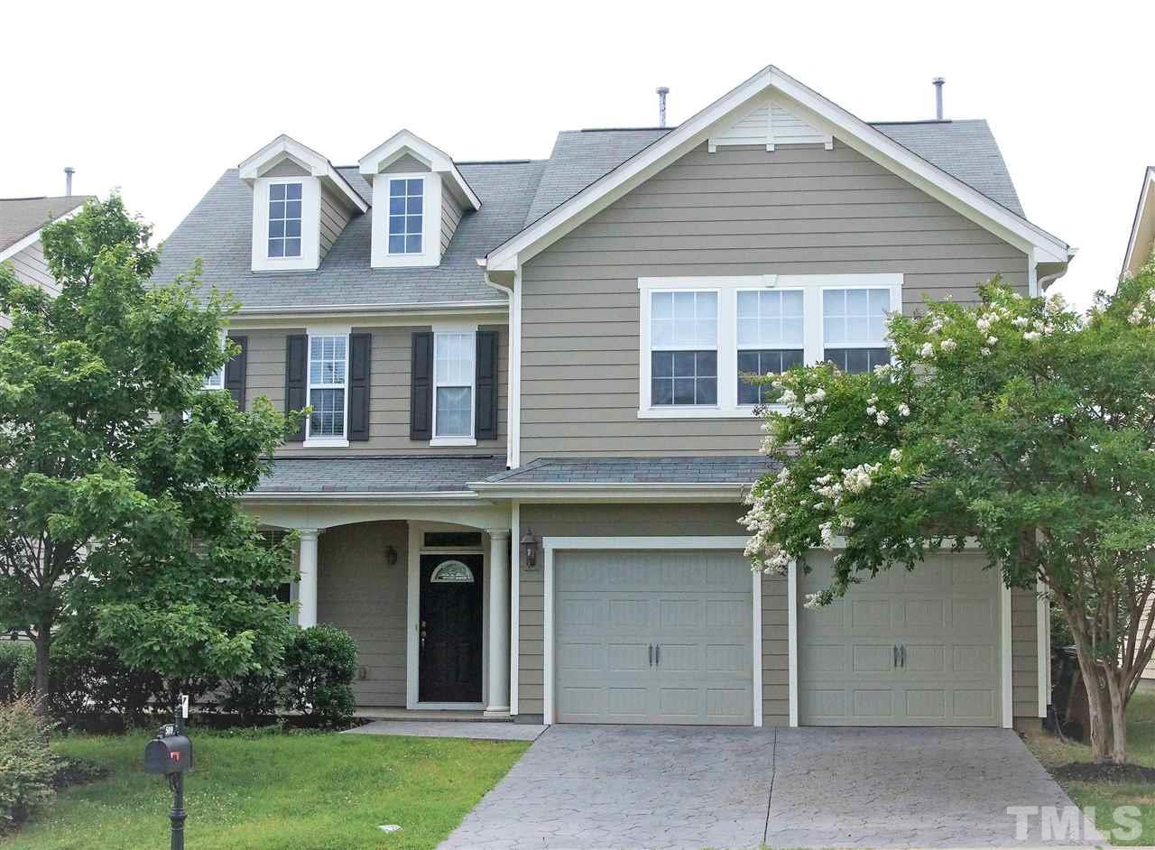 509 Front Ridge Drive Cary, NC 27519 - Photo 1 of 30 a front view of a house with a garden