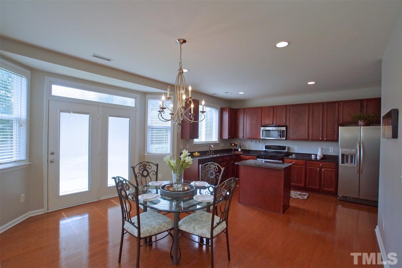 509 Front Ridge Drive Cary, NC 27519 - Photo 11 of 30 a large kitchen with a table and chairs