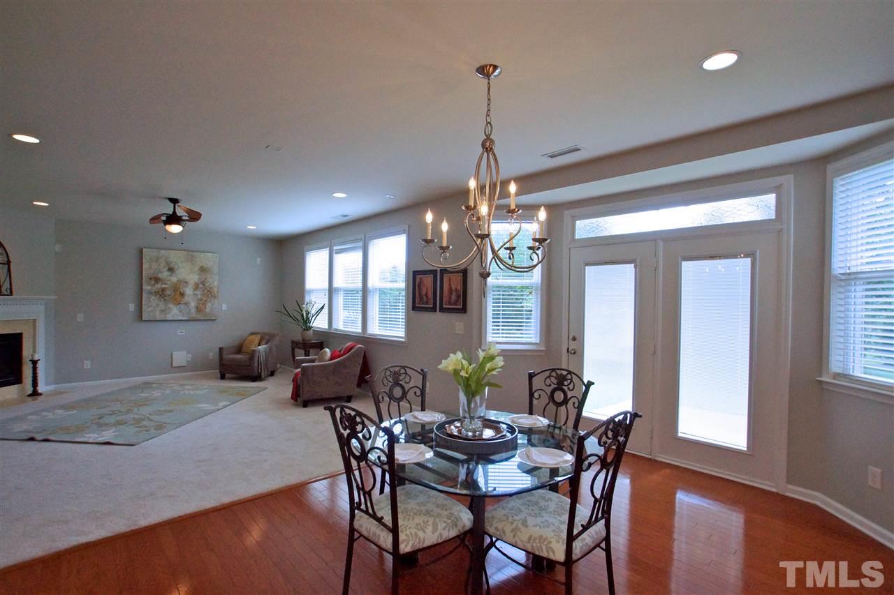 509 Front Ridge Drive Cary, NC 27519 - Photo 12 of 30 a view of a dining room with furniture window and wooden floor