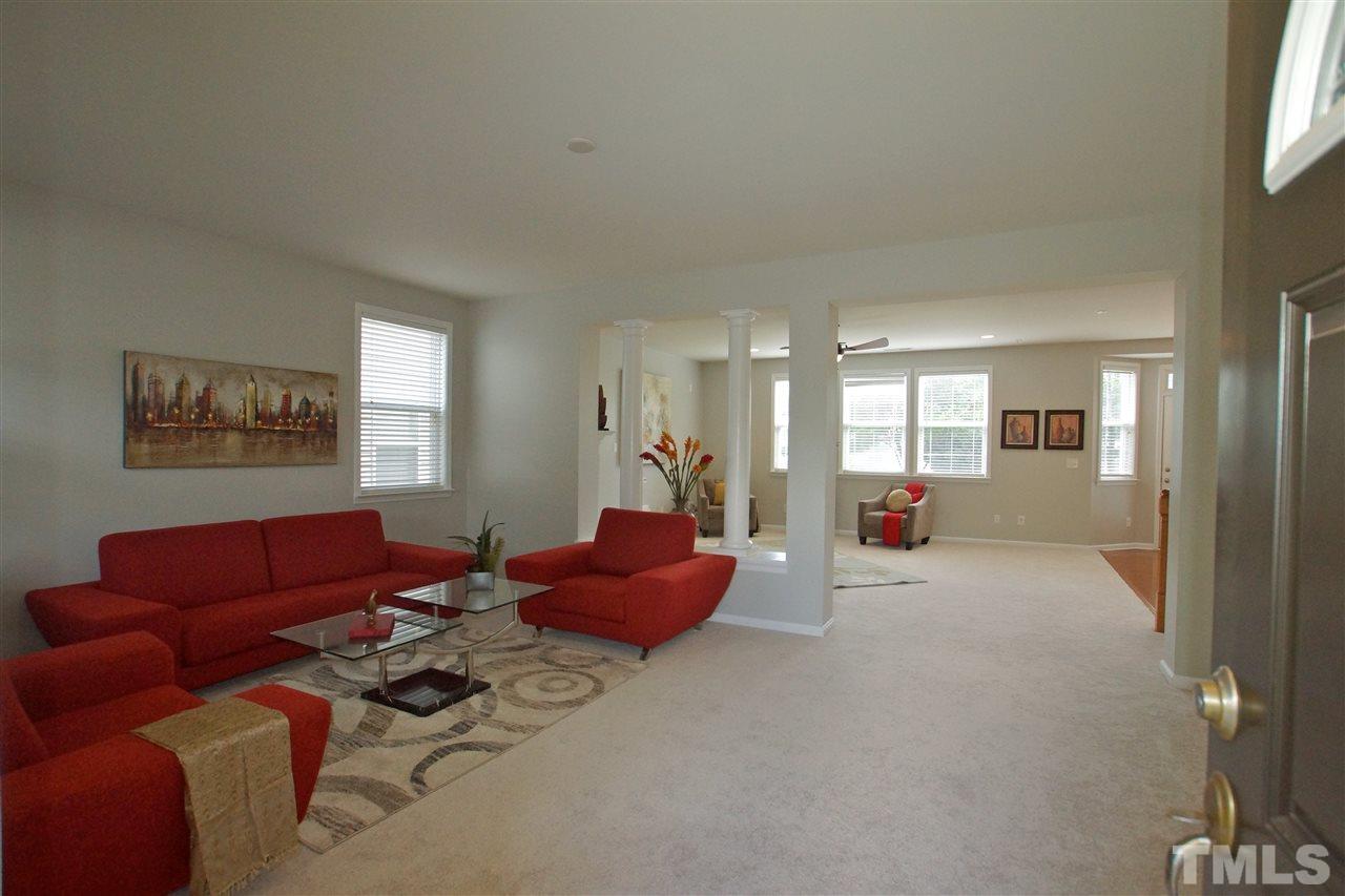 509 Front Ridge Drive Cary, NC 27519 - Photo 6 of 30 a living room with furniture and a window